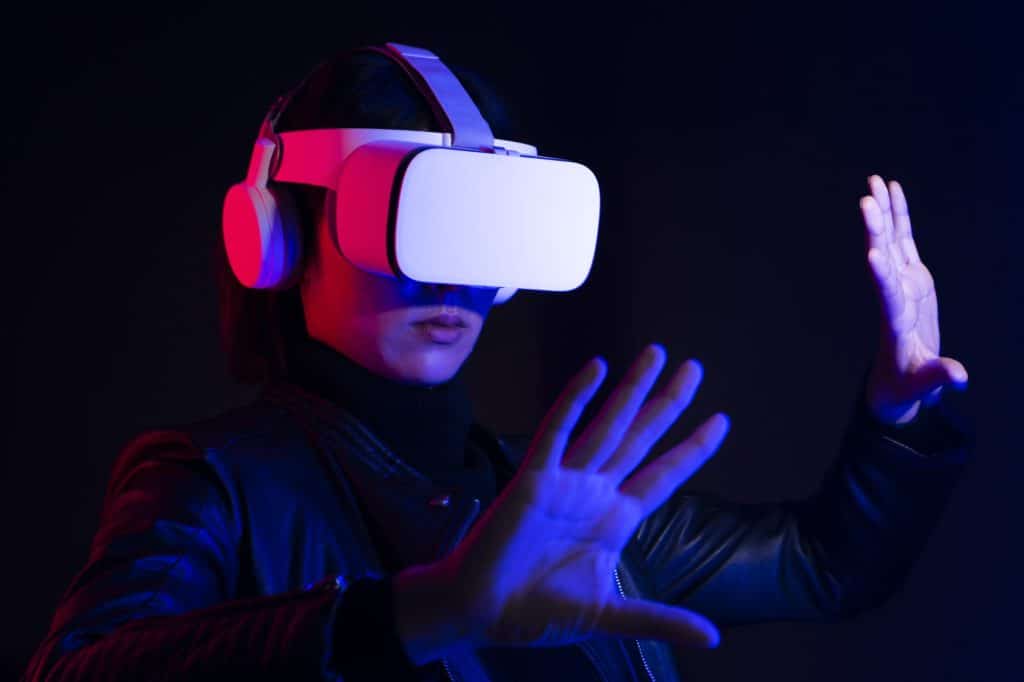 Woman playing a virtual video game on virtual screen
